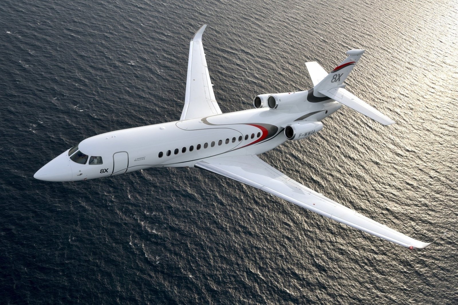 Dassault Falcon 8X in flight over open water
