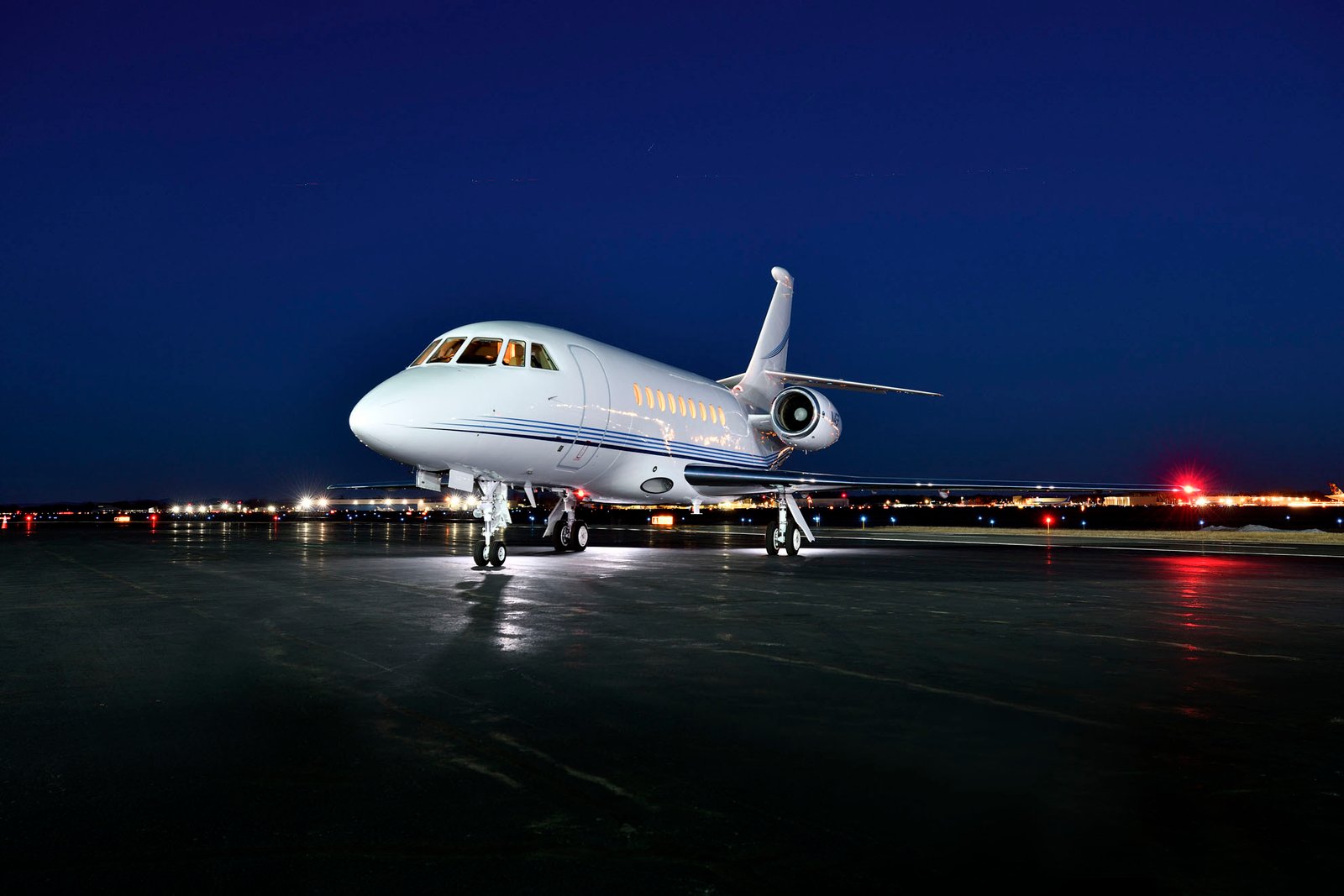 Luxury private jet positioned on airport apron at sunrise