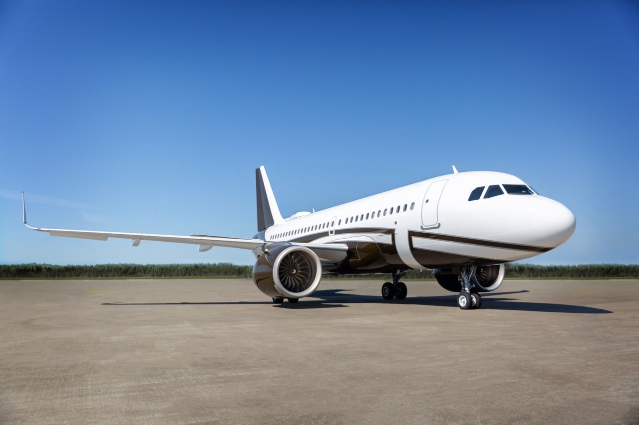 Luxury private jet on runway at golden hour