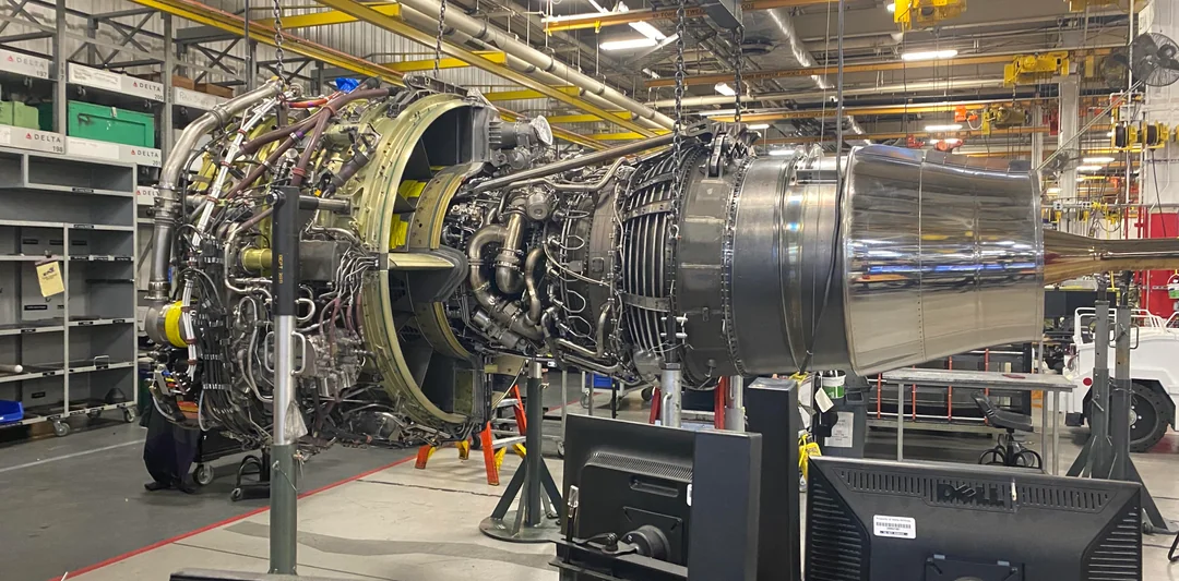 CFM56 engine in MRO facility with technicians performing heavy maintenance shop visit