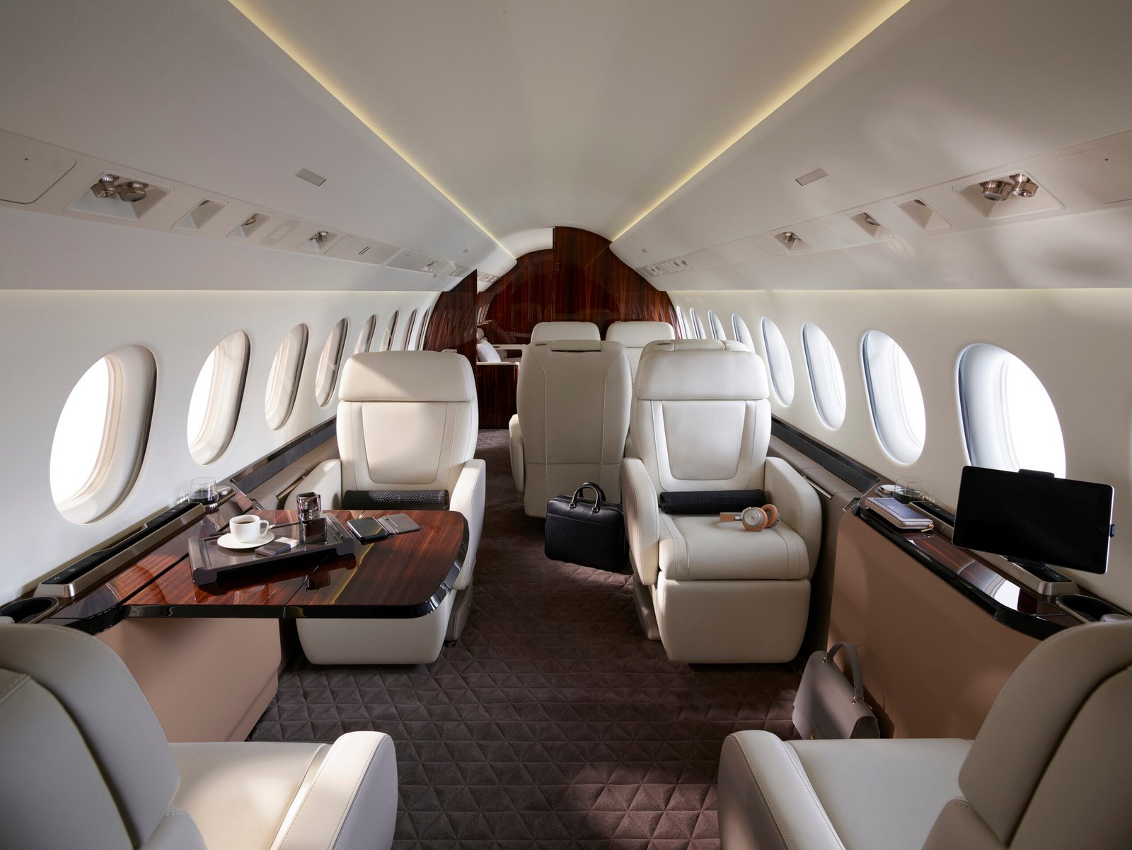 Luxury business jet cabin interior with cream leather seating