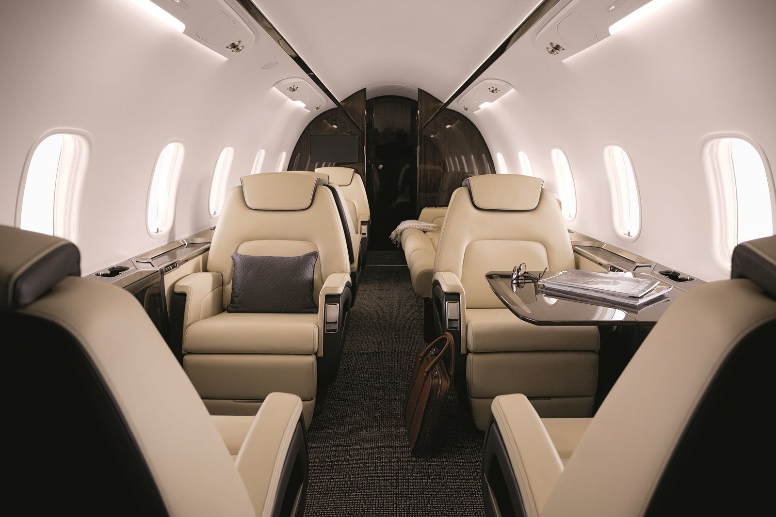 Interior cabin of a Bombardier Challenger 350, showing seating and cabin layout