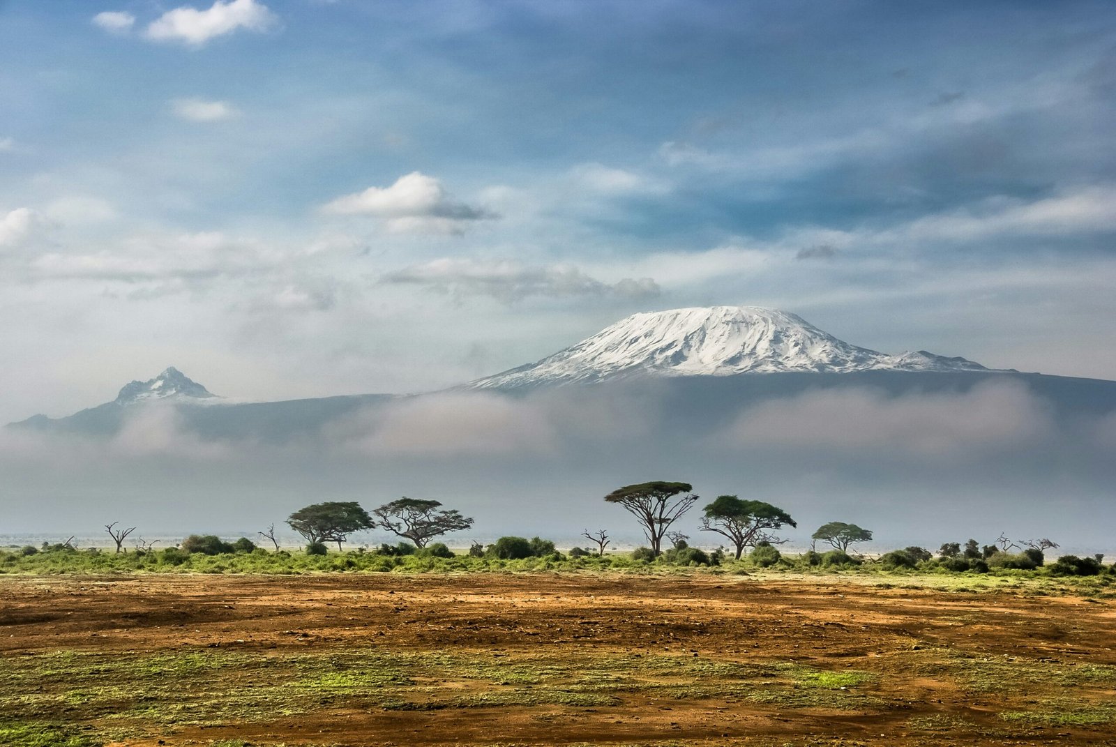 Mount Kilimanjaro's snow-capped peak rising above the Amboseli plains