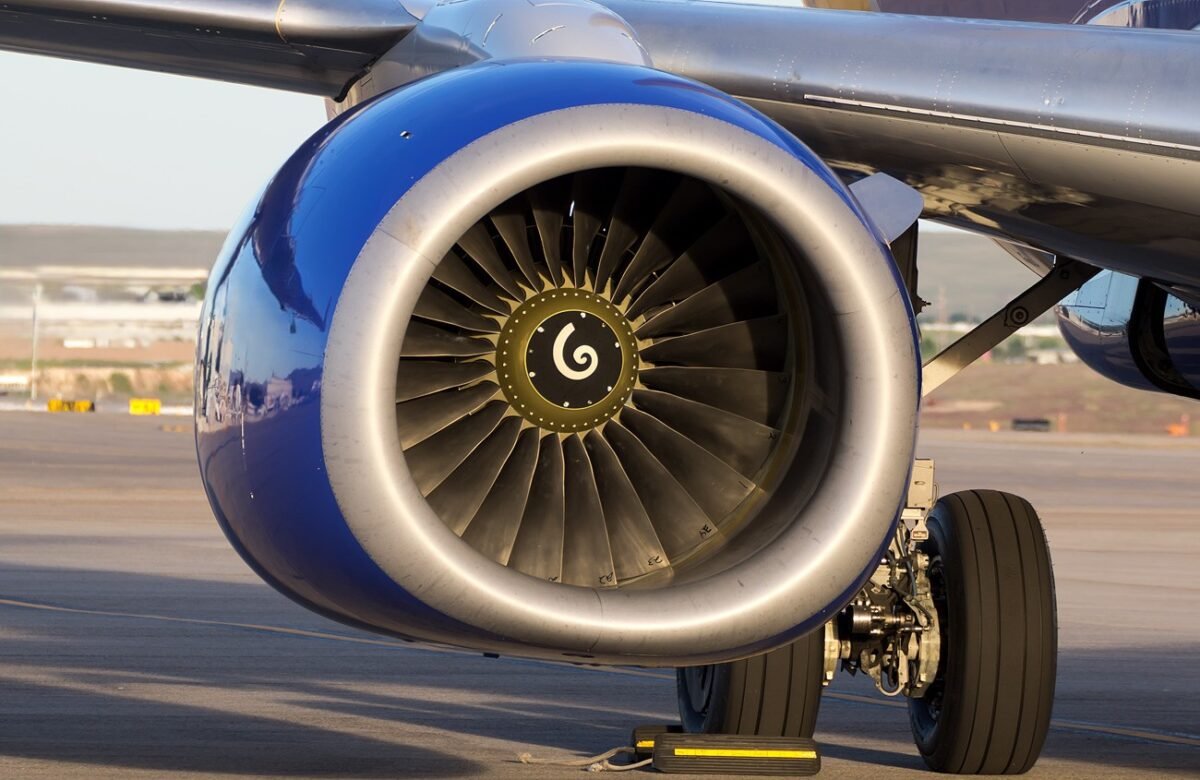 CFM56 turbofan engine mounted under the wing of a Boeing 737 with the fan face and nose cone visible
