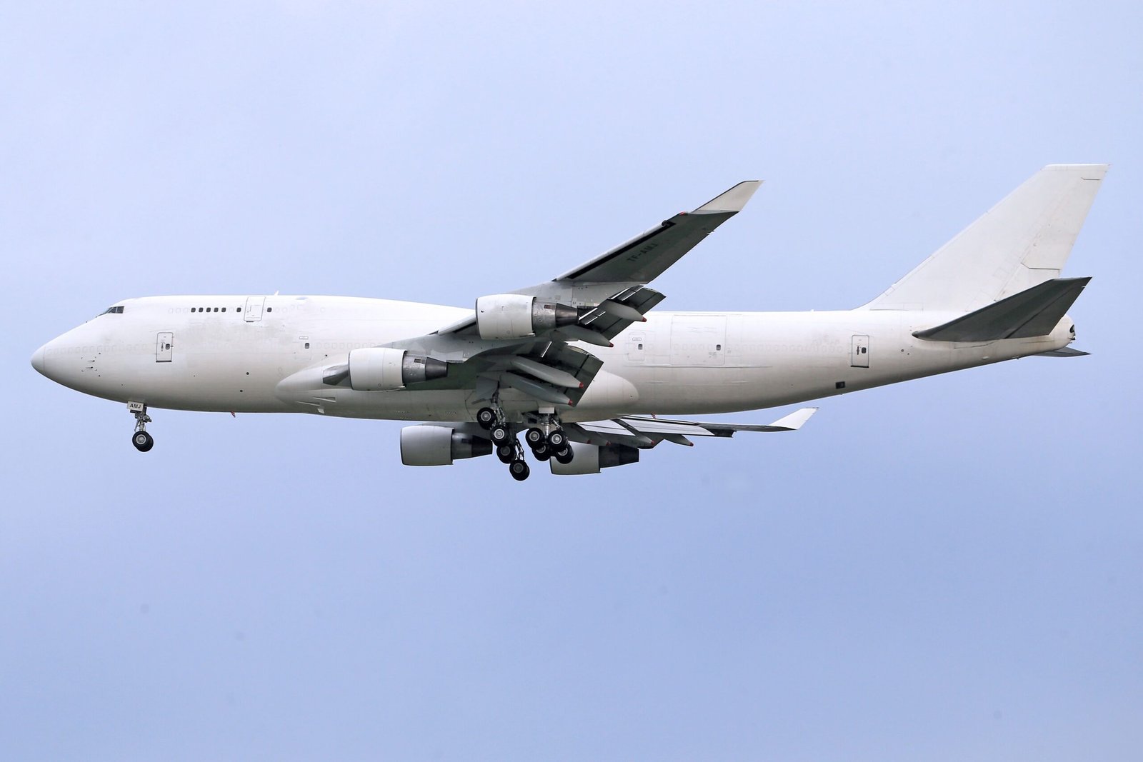 Boeing 747 freighter on approach, main-deck cargo door visible