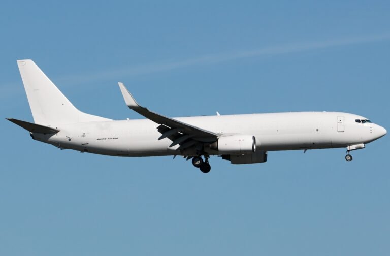 White Boeing 737-800 converted freighter on approach to land with landing gear down