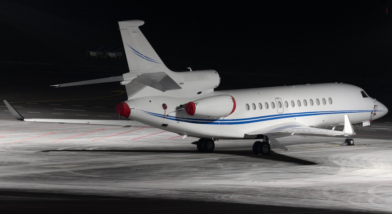 Business jet parked on airport apron