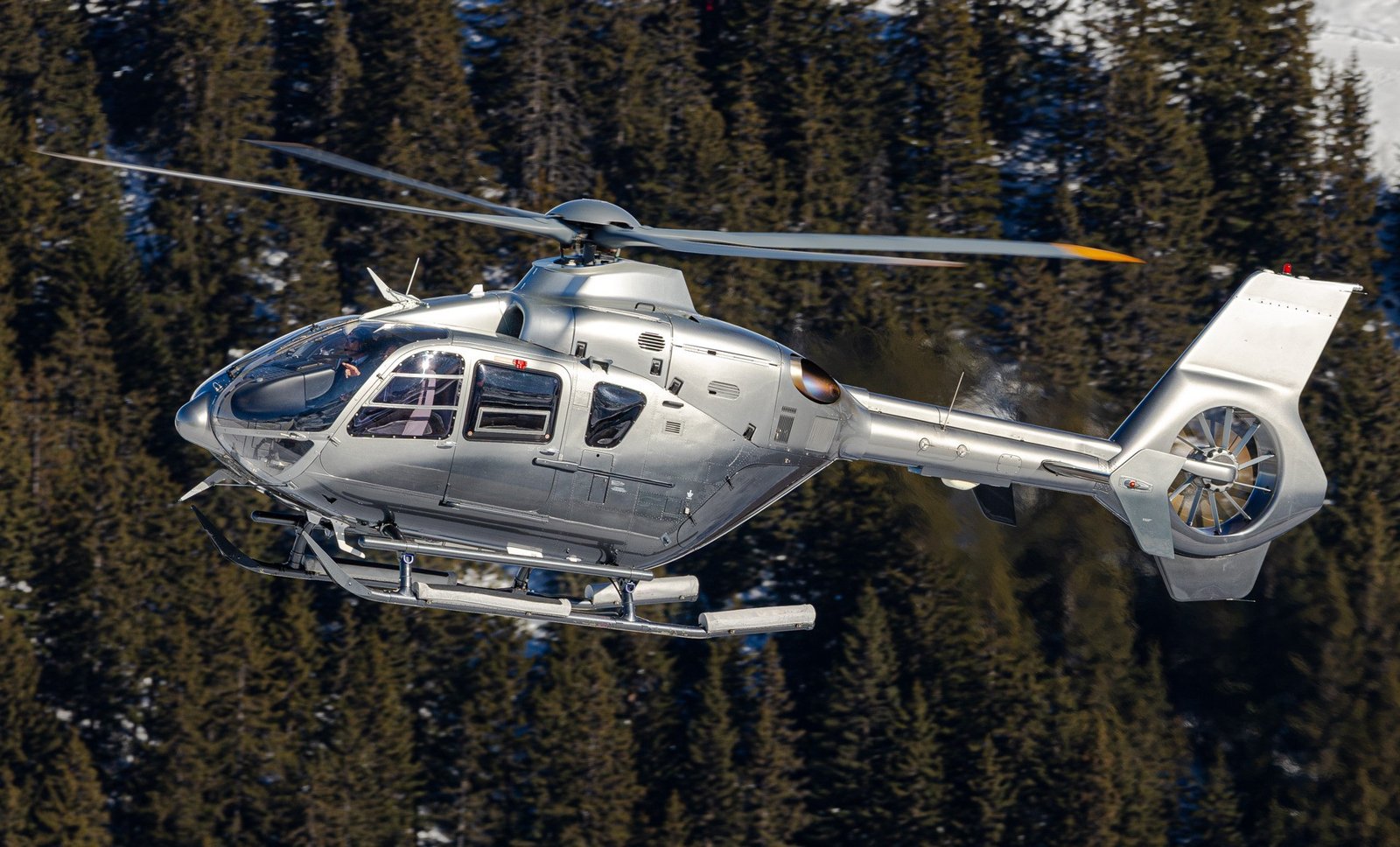 Eurocopter EC135 P2 helicopter, demonstrating its sleek profile in flight.