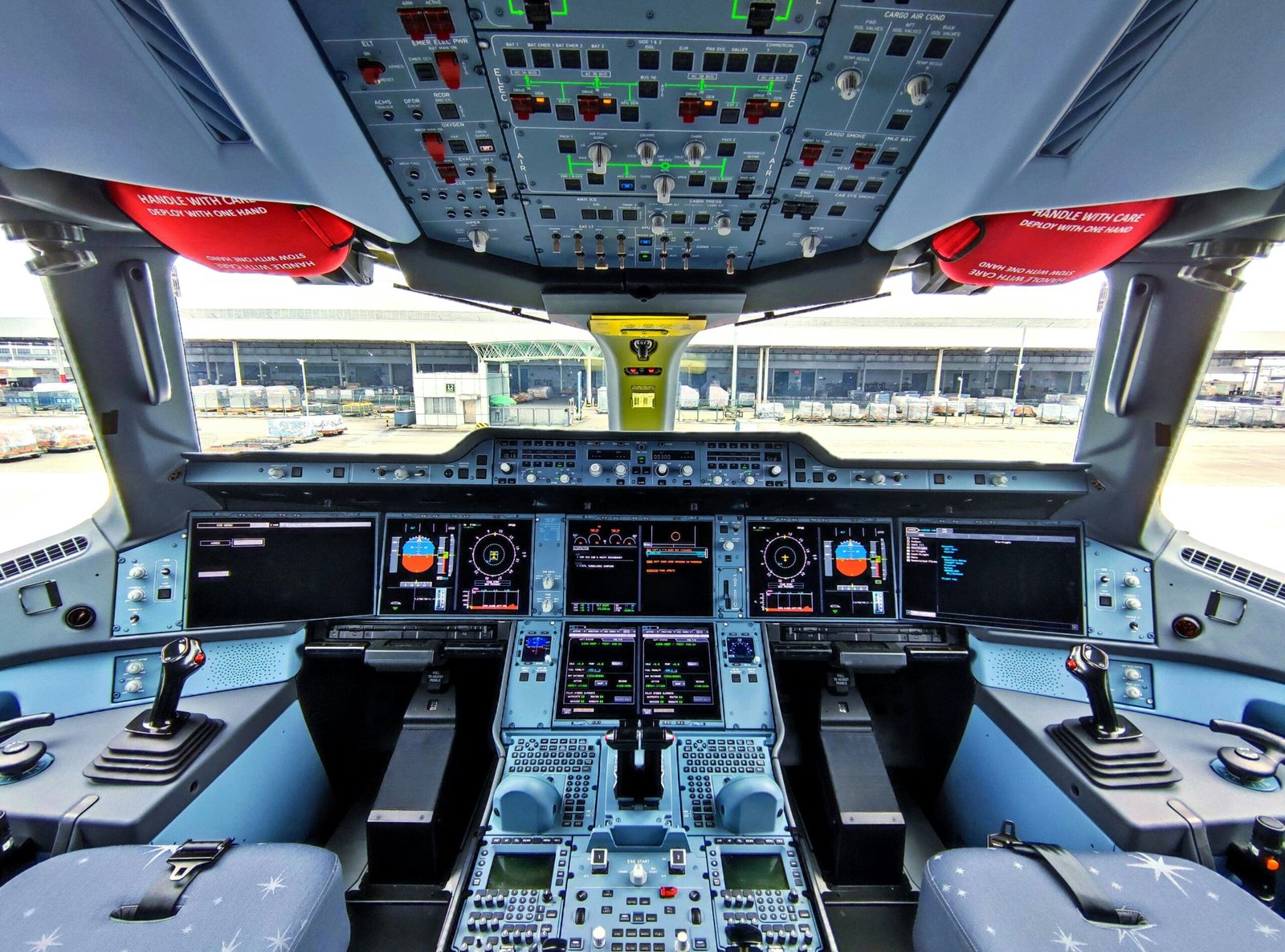 Glass cockpit flight deck showing modern aircraft automation and flight instruments