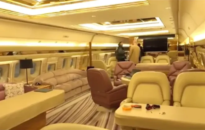 Inside cabin view of Drake's Boeing 767 private jet with lounge-style seating