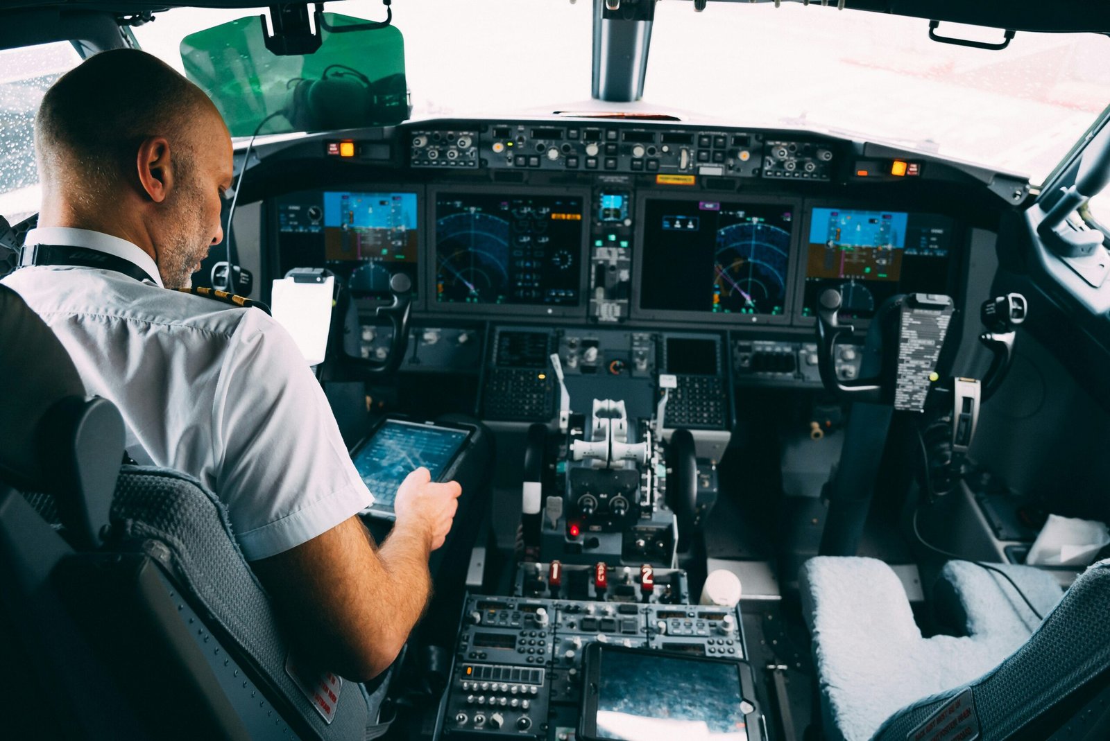 Senior, experienced pilot weighing a decision in the flight deck