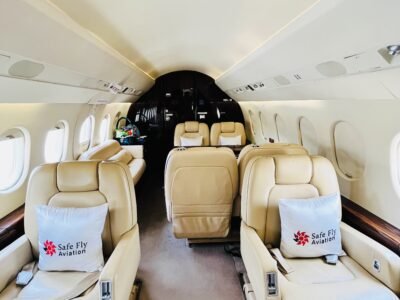 Falcon 2000 private jet interior featuring luxurious seat configuration, showcasing plush seating and high-end amenities