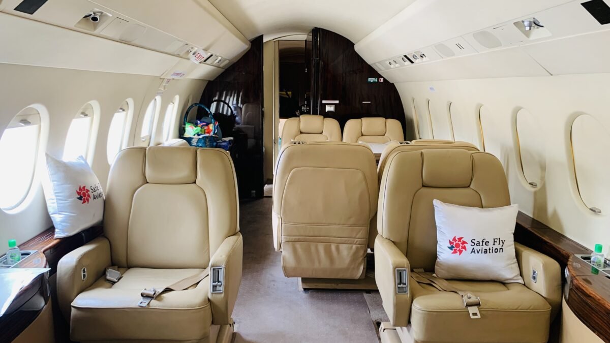 A luxurious private jet ready for takeoff on a sunny day, showcasing the sleek design and comfort of air charter services