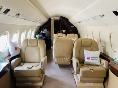 A luxurious private jet ready for takeoff on a sunny day, showcasing the sleek design and comfort of air charter services