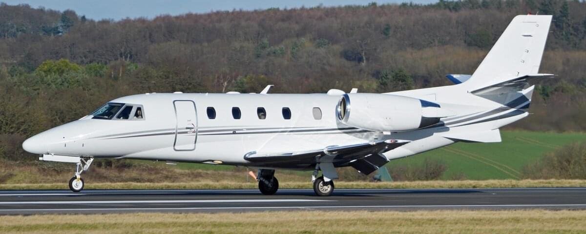 Cessna Citation XLS midsize business jet parked on a runway, showcasing its sleek design, spacious cabin windows, and Pratt & Whitney engines. Ideal for corporate travel, private charters, and special missions.