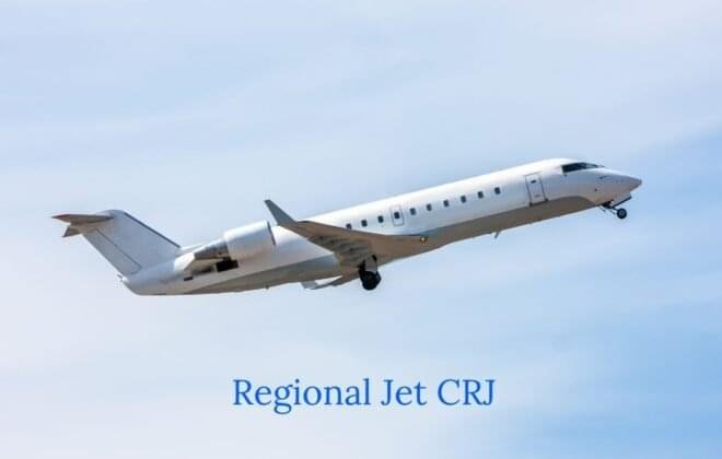 CRJ 700 aircraft soaring through the sky